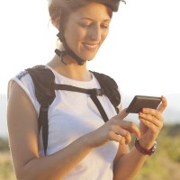 Cyclist using her smartphone